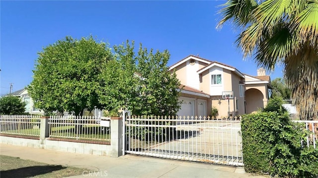 1018 Palm Ave, San Gabriel, CA 91776 - view of front of home with stucco siding, concrete driveway, and a garage
