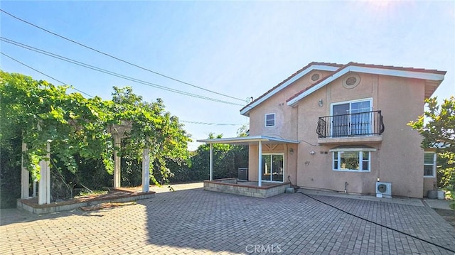 1018 Palm Ave, San Gabriel, CA 91776 - back of property with stucco siding, a patio area, and a balcony