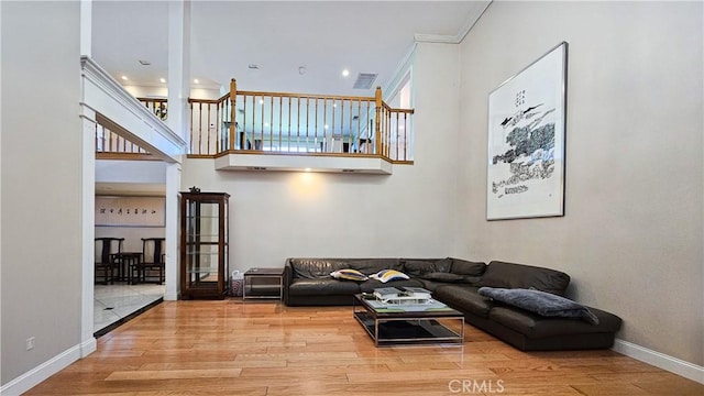 1018 Palm Ave, San Gabriel, CA 91776 - living area with wood finished floors, a towering ceiling, and crown molding