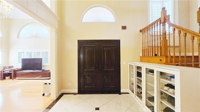 1018 Palm Ave, San Gabriel, CA 91776 - tiled foyer featuring a high ceiling, healthy amount of natural light, and inlaid floor details