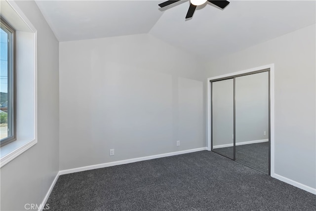 2217 Juniper Ln, Big Bear City, CA 92314 - unfurnished bedroom featuring lofted ceiling, dark colored carpet, a ceiling fan, and a closet