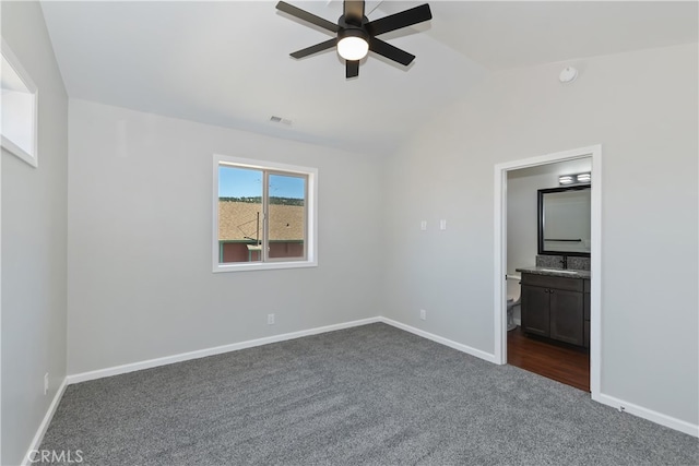 2217 Juniper Ln, Big Bear City, CA 92314 - unfurnished bedroom featuring dark colored carpet, vaulted ceiling, and ensuite bath