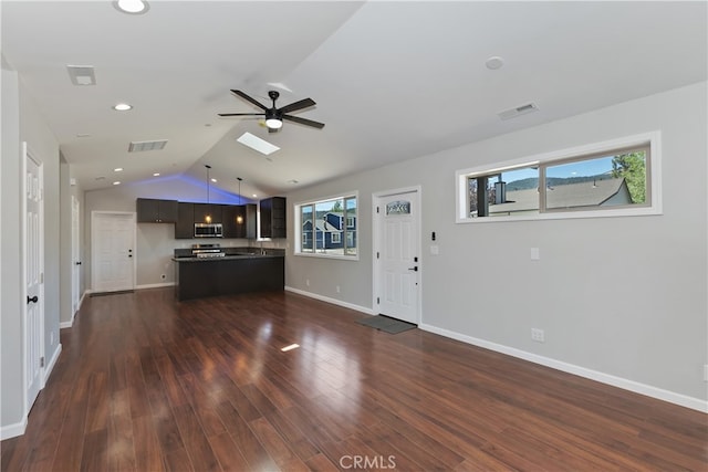 2217 Juniper Ln, Big Bear City, CA 92314 - unfurnished living room with a ceiling fan, dark wood finished floors, lofted ceiling, healthy amount of natural light, and recessed lighting