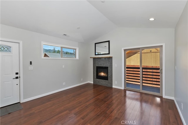 2217 Juniper Ln, Big Bear City, CA 92314 - unfurnished living room featuring a tile fireplace, lofted ceiling, and wood finished floors