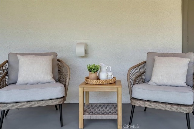 3531 Josie Ave, Long Beach, CA 90808 - sitting room featuring finished concrete flooring and a textured wall