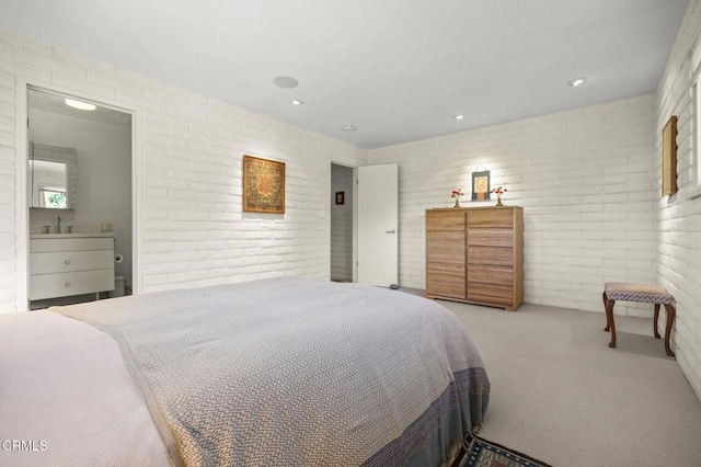 4530 Hendrickson Rd, Ojai, CA 93023 - carpeted bedroom featuring brick wall and a sink