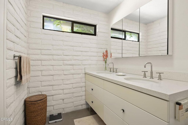4530 Hendrickson Rd, Ojai, CA 93023 - full bathroom with double vanity and brick wall