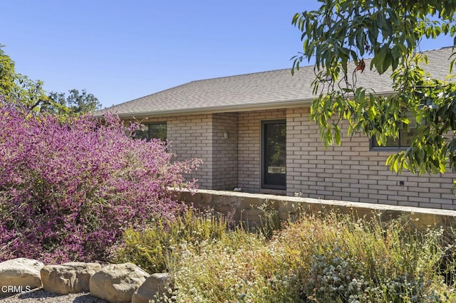 4530 Hendrickson Rd, Ojai, CA 93023 - back of house with brick siding and roof with shingles