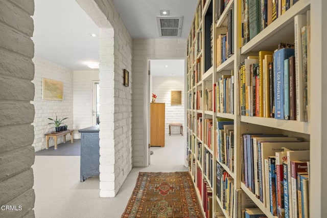 4530 Hendrickson Rd, Ojai, CA 93023 - hallway with brick wall and carpet flooring