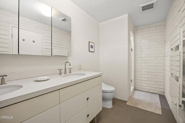 4530 Hendrickson Rd, Ojai, CA 93023 - full bathroom featuring double vanity, tile patterned flooring, and walk in shower
