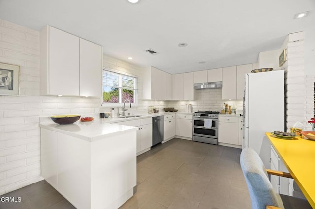 4530 Hendrickson Rd, Ojai, CA 93023 - kitchen with stainless steel appliances, under cabinet range hood, white cabinets, light countertops, and recessed lighting