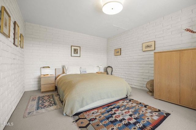 4530 Hendrickson Rd, Ojai, CA 93023 - bedroom featuring brick wall and light carpet