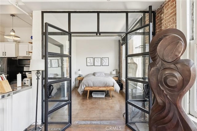 215 W 7th St Unit 1108, Los Angeles, CA 90014 - bedroom featuring freestanding refrigerator and tile patterned floors