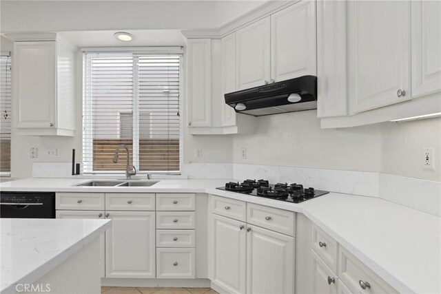 28403 Calex Dr, Valencia, CA 91354 - kitchen with under cabinet range hood, black appliances, white cabinetry, and light stone counters