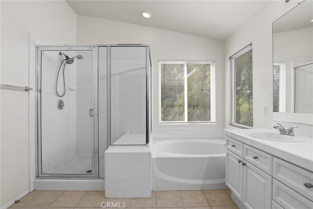 28403 Calex Dr, Valencia, CA 91354 - bathroom with vanity, vaulted ceiling, a shower stall, a bath, and tile patterned flooring