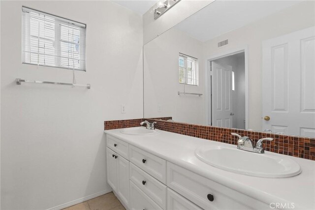 28403 Calex Dr, Valencia, CA 91354 - full bath featuring double vanity, decorative backsplash, and tile patterned flooring