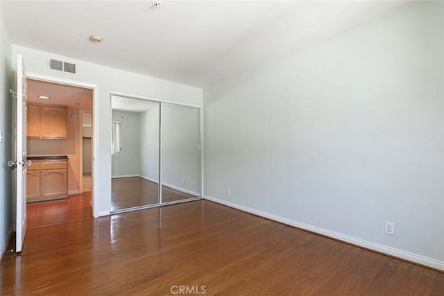 400 N 6th St Unit 202, Burbank, CA 91501 - unfurnished bedroom featuring dark wood-type flooring and a closet