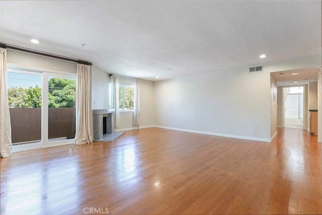 400 N 6th St Unit 202, Burbank, CA 91501 - unfurnished living room with light wood finished floors, a fireplace, and recessed lighting
