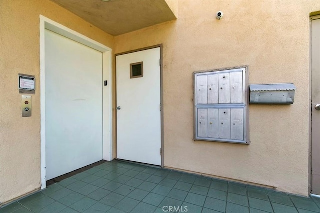 400 N 6th St Unit 202, Burbank, CA 91501 - doorway to property featuring stucco siding and a surveillance system
