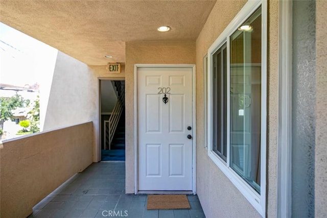 400 N 6th St Unit 202, Burbank, CA 91501 - doorway to property featuring a balcony and stucco siding