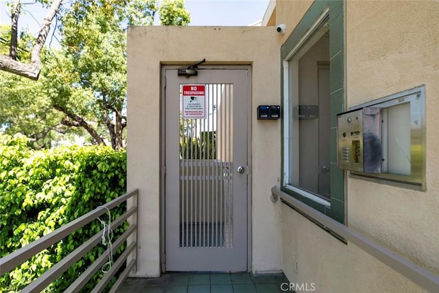 400 N 6th St Unit 202, Burbank, CA 91501 - entrance to property featuring stucco siding and a security system