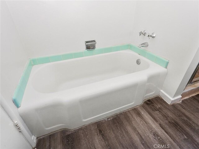 2623 N Parish Pl, Burbank, CA 91504 - bathroom with wood finished floors and a bath