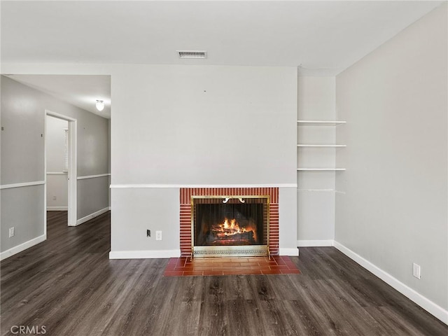 2623 N Parish Pl, Burbank, CA 91504 - unfurnished living room with wood finished floors and a brick fireplace
