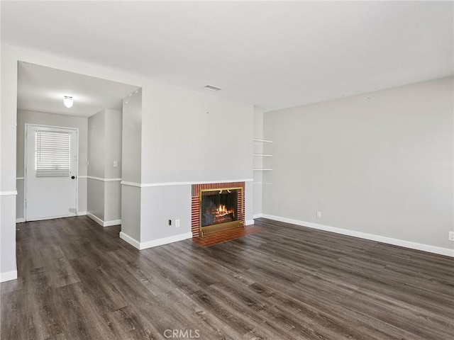 2623 N Parish Pl, Burbank, CA 91504 - unfurnished living room featuring wood finished floors and a brick fireplace