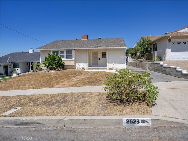 2623 N Parish Pl, Burbank, CA 91504 - ranch-style house with stucco siding and a chimney