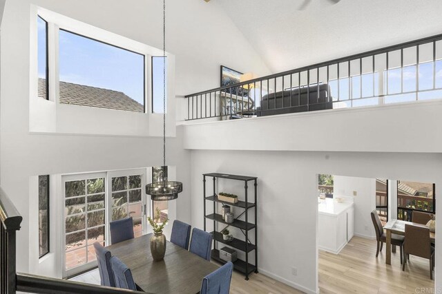1471 Mercado, Escondido, CA 92026 - dining room with high vaulted ceiling, wood finished floors, a chandelier, and healthy amount of natural light