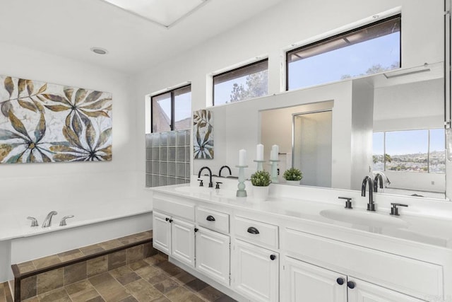 1471 Mercado, Escondido, CA 92026 - full bathroom with stone finish flooring, double vanity, healthy amount of natural light, and a tub