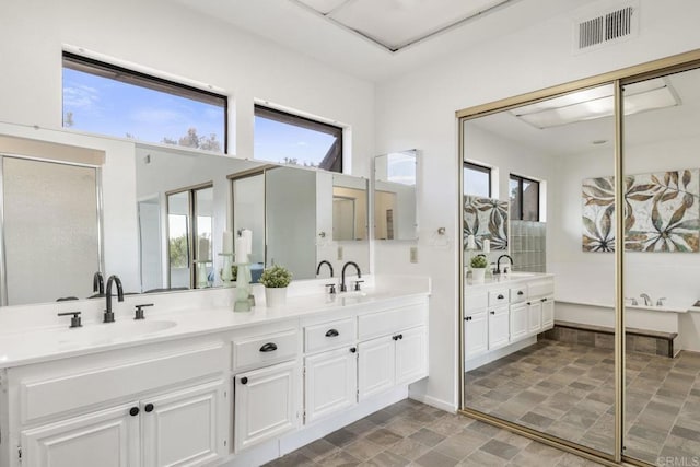 1471 Mercado, Escondido, CA 92026 - full bath with double vanity, stone finish flooring, and healthy amount of natural light