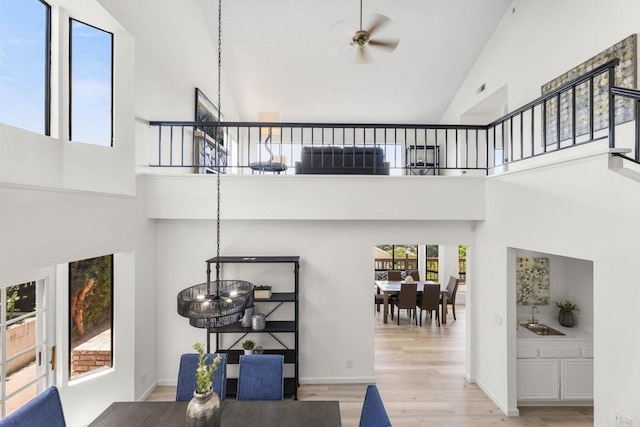 1471 Mercado, Escondido, CA 92026 - stairs featuring high vaulted ceiling, wood finished floors, ceiling fan, and a chandelier