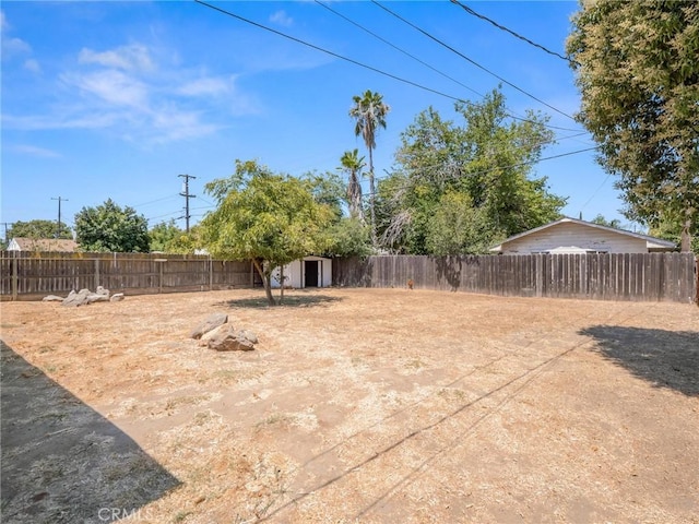 2135 Arden Dr W, Fresno, CA 93703 - fenced backyard featuring a storage unit