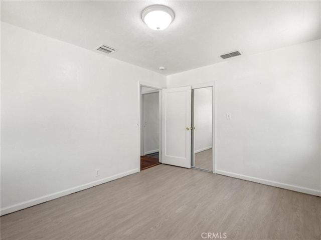 2135 Arden Dr W, Fresno, CA 93703 - unfurnished bedroom featuring wood finished floors and a closet