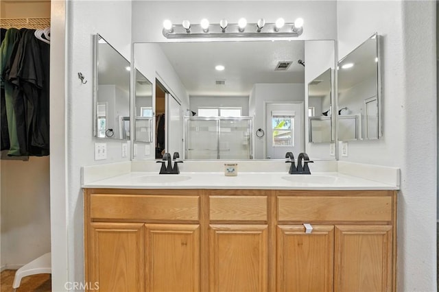 23885 Cheyenne Canyon Dr, Menifee, CA 92587 - bathroom featuring double vanity, a stall shower, and a walk in closet