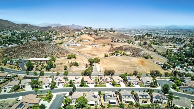 23885 Cheyenne Canyon Dr, Menifee, CA 92587 - aerial overview of property's location featuring a mountain backdrop and nearby suburban area