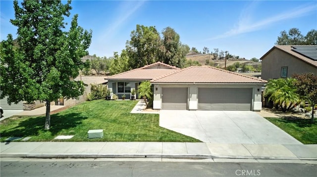 23885 Cheyenne Canyon Dr, Menifee, CA 92587 - ranch-style house with an attached garage, stucco siding, a tiled roof, a front yard, and concrete driveway