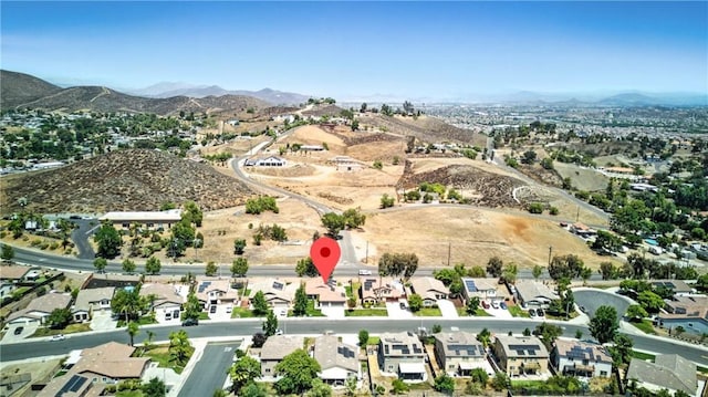 23885 Cheyenne Canyon Dr, Menifee, CA 92587 - aerial view of property's location featuring a mountain backdrop and nearby suburban area