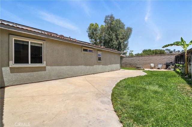 23885 Cheyenne Canyon Dr, Menifee, CA 92587 - view of property exterior featuring a patio, a fenced backyard, and stucco siding