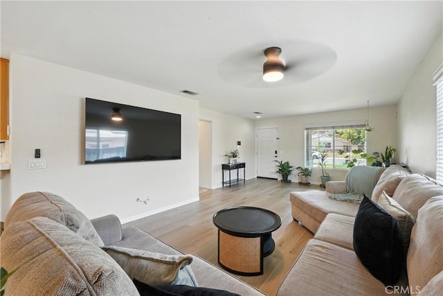 23885 Cheyenne Canyon Dr, Menifee, CA 92587 - living room with a ceiling fan and light wood-style floors