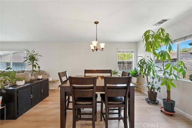 23885 Cheyenne Canyon Dr, Menifee, CA 92587 - dining room featuring plenty of natural light and a chandelier