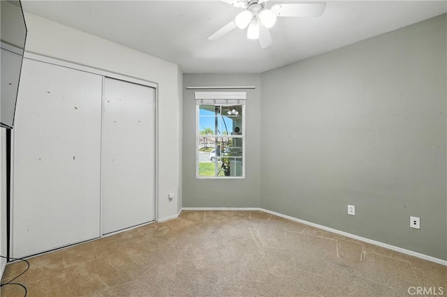 23885 Cheyenne Canyon Dr, Menifee, CA 92587 - unfurnished bedroom with carpet, a closet, and ceiling fan