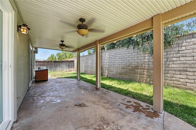 23885 Cheyenne Canyon Dr, Menifee, CA 92587 - fenced backyard with a patio and ceiling fan