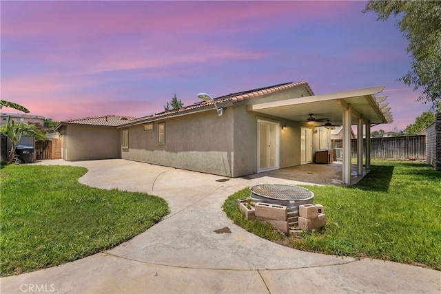 23885 Cheyenne Canyon Dr, Menifee, CA 92587 - view of front of house with a ceiling fan, a patio area, and stucco siding