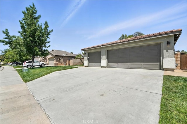 23885 Cheyenne Canyon Dr, Menifee, CA 92587 - view of front facade with stucco siding, a tiled roof, a detached garage, and a front yard