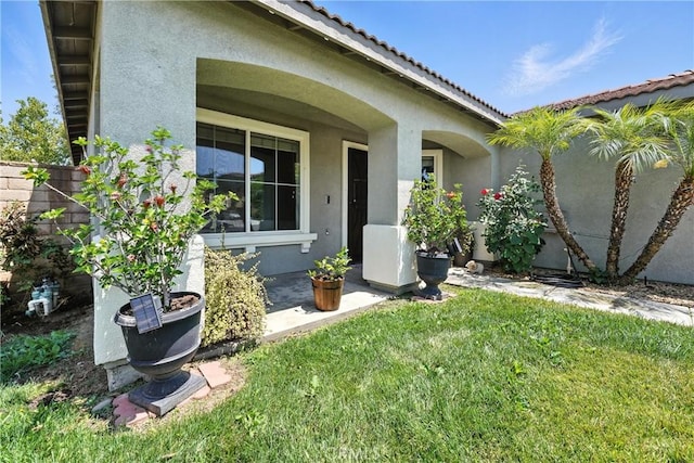 23885 Cheyenne Canyon Dr, Menifee, CA 92587 - doorway to property featuring stucco siding and a tile roof