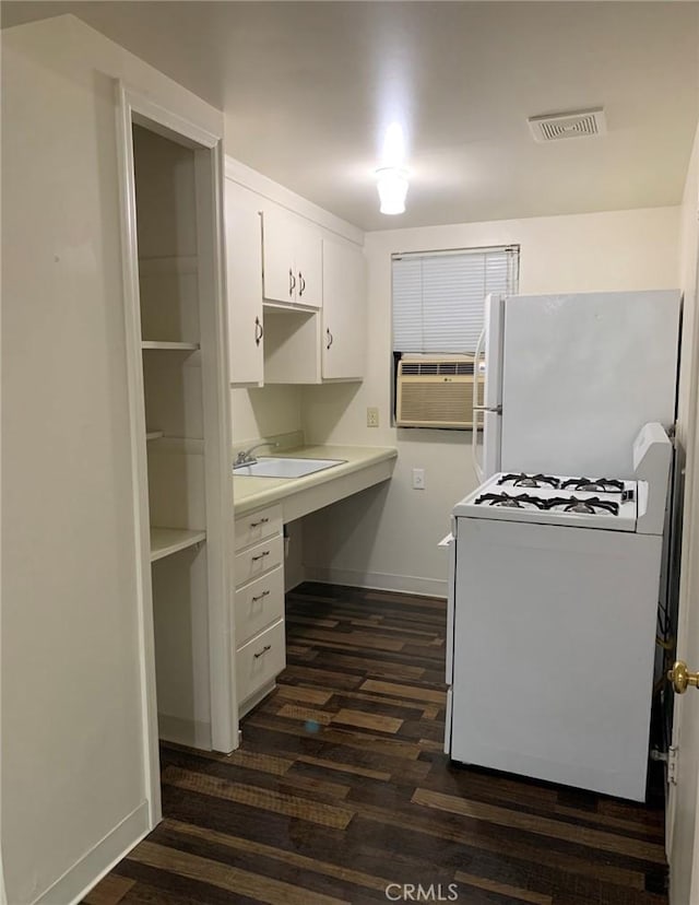 1326 Mulberry St, Chico, CA 95928 - kitchen featuring white appliances, white cabinetry, dark wood-style floors, and light countertops