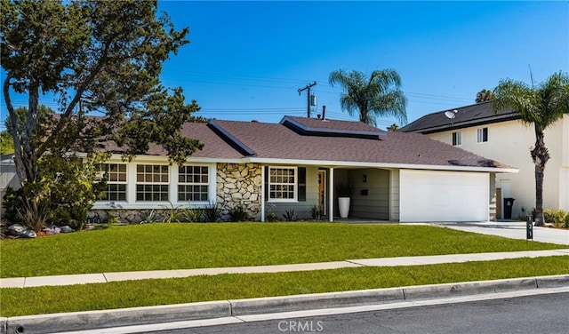 121 W Borromeo Ave, Placentia, CA 92870 - view of front of property with an attached garage, a front yard, driveway, and stone siding
