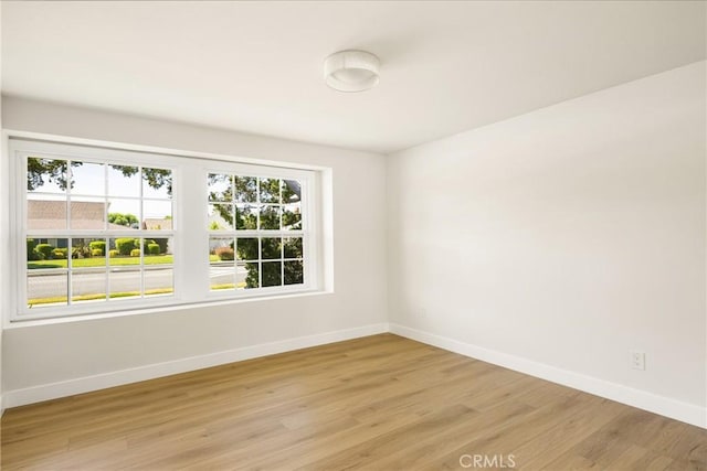 121 W Borromeo Ave, Placentia, CA 92870 - empty room with baseboards and light wood-style floors